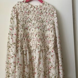 smocked puff sleeve white shirt with flowers. good condition. worn twice
